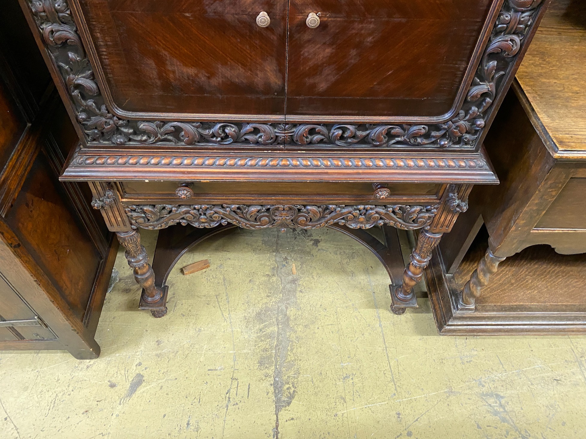 A 17th century style oak cocktail cabinet on stand, width 90cm, depth 50cm, height 137cm